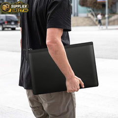 PrepPro Australia fireproof and waterproof document bag in black, held by a person for emergency document protection.