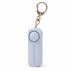 Lavender personal alarm keyring with LED light on a white background