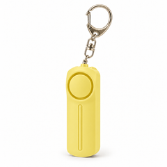 Yellow personal alarm keyring with LED light on a white background