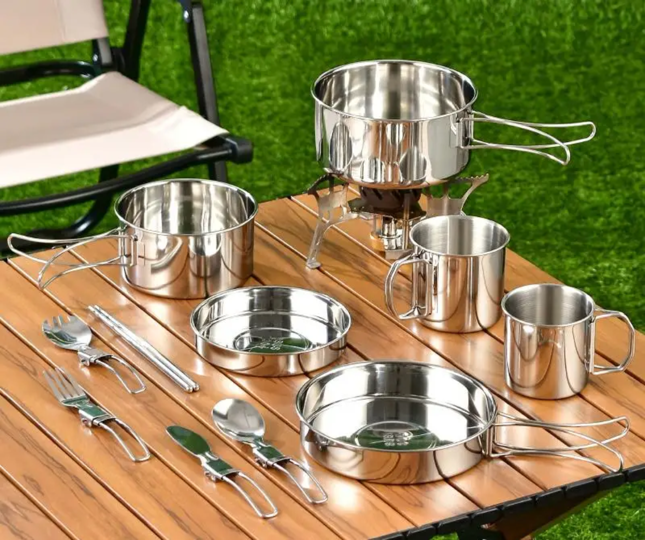 Portable stainless steel camping cookware set with pots, pans and cups for outdoor cooking, camping and survival kits.